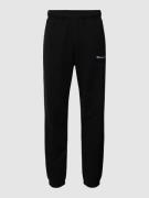 CHAMPION Sweatpants mit Label-Stitching in Black, Größe M