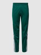 adidas Originals Sweatpants mit Galonstreifen in Dunkelgruen, Größe XX...