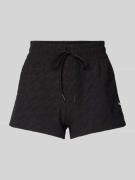 PUMA PERFORMANCE Shorts mit Logo-Muster in Black, Größe XS