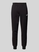 PUMA PERFORMANCE Relaxed Fit Sweatpants mit Label-Print in Black, Größ...