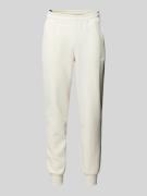 PUMA PERFORMANCE Relaxed Fit Sweatpants mit Label-Print in Offwhite, G...