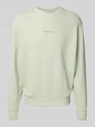 Tommy Jeans Comfort Fit Pullover aus reiner Baumwolle in Schilf, Größe...