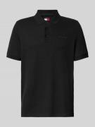Tommy Jeans Regular Fit Poloshirt aus reiner Baumwolle in Black, Größe...