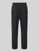 CHAMPION Regular Fit Sweatpants mit Label-Stitching in Black, Größe M