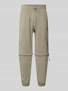 adidas Sportswear Relaxed Fit Sweatpants mit Logo-Print in Schilf, Grö...