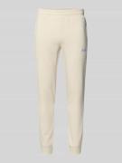 PUMA PERFORMANCE Sweatpants mit Label-Stitching in Offwhite, Größe L