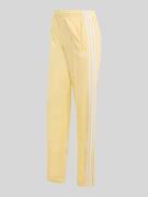 adidas Originals Trainingshose mit Logo Details in Hellgelb, Größe L