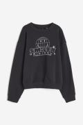 H&M Sweatshirt mit Print Dunkelgrau/Smiley®, Sweatshirts in Größe XS. ...